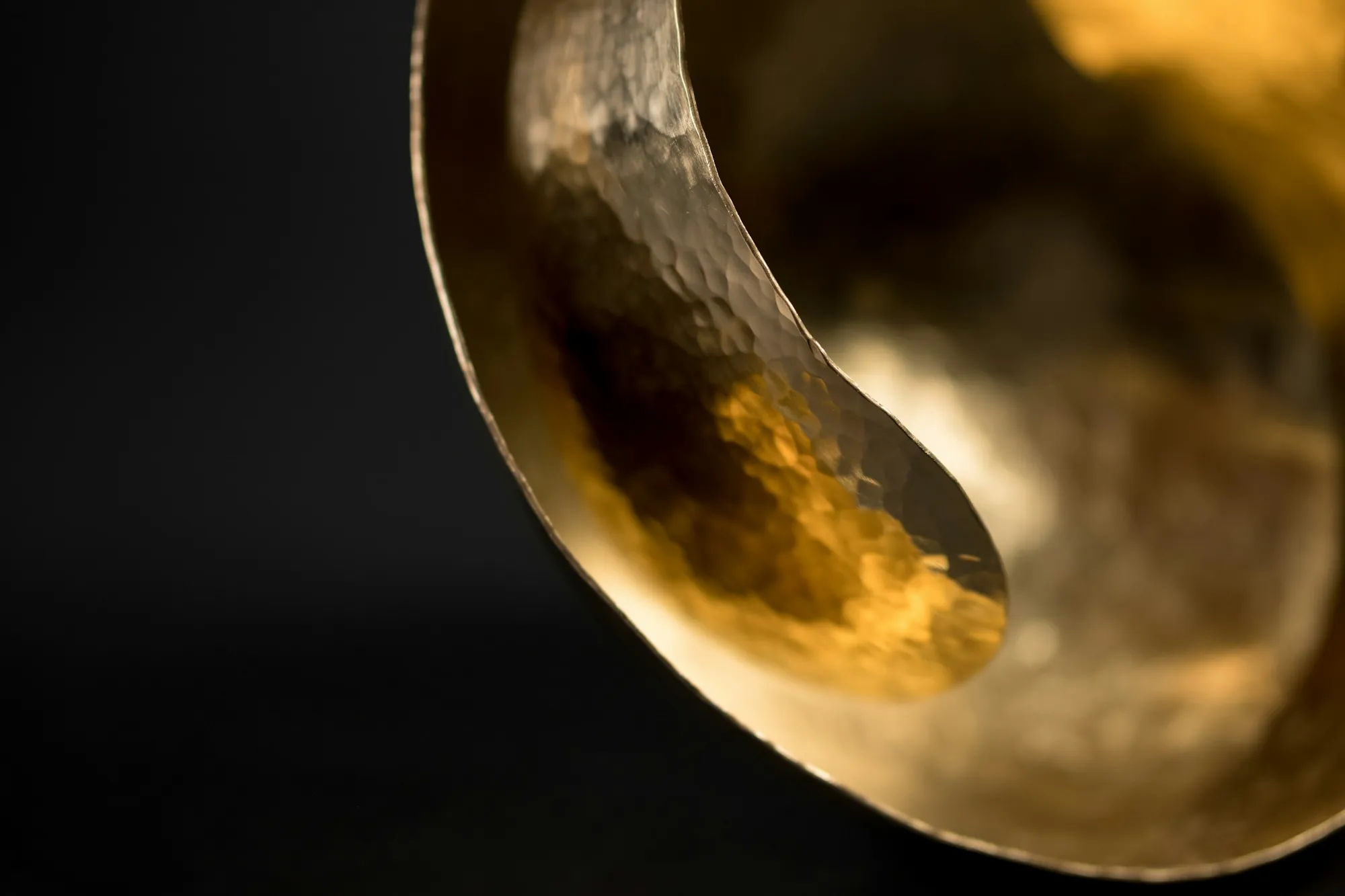 A hammered brass bowl