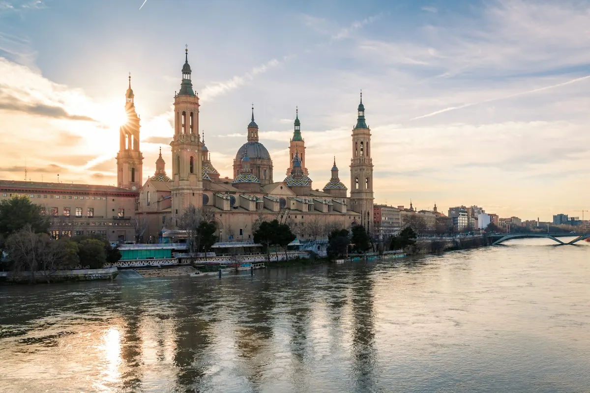 Old buildings beside a river